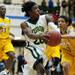 Huron senior Demetris Sims drives to the rim in the second half of the game on Friday, March 8. Daniel Brenner I AnnArbor.com